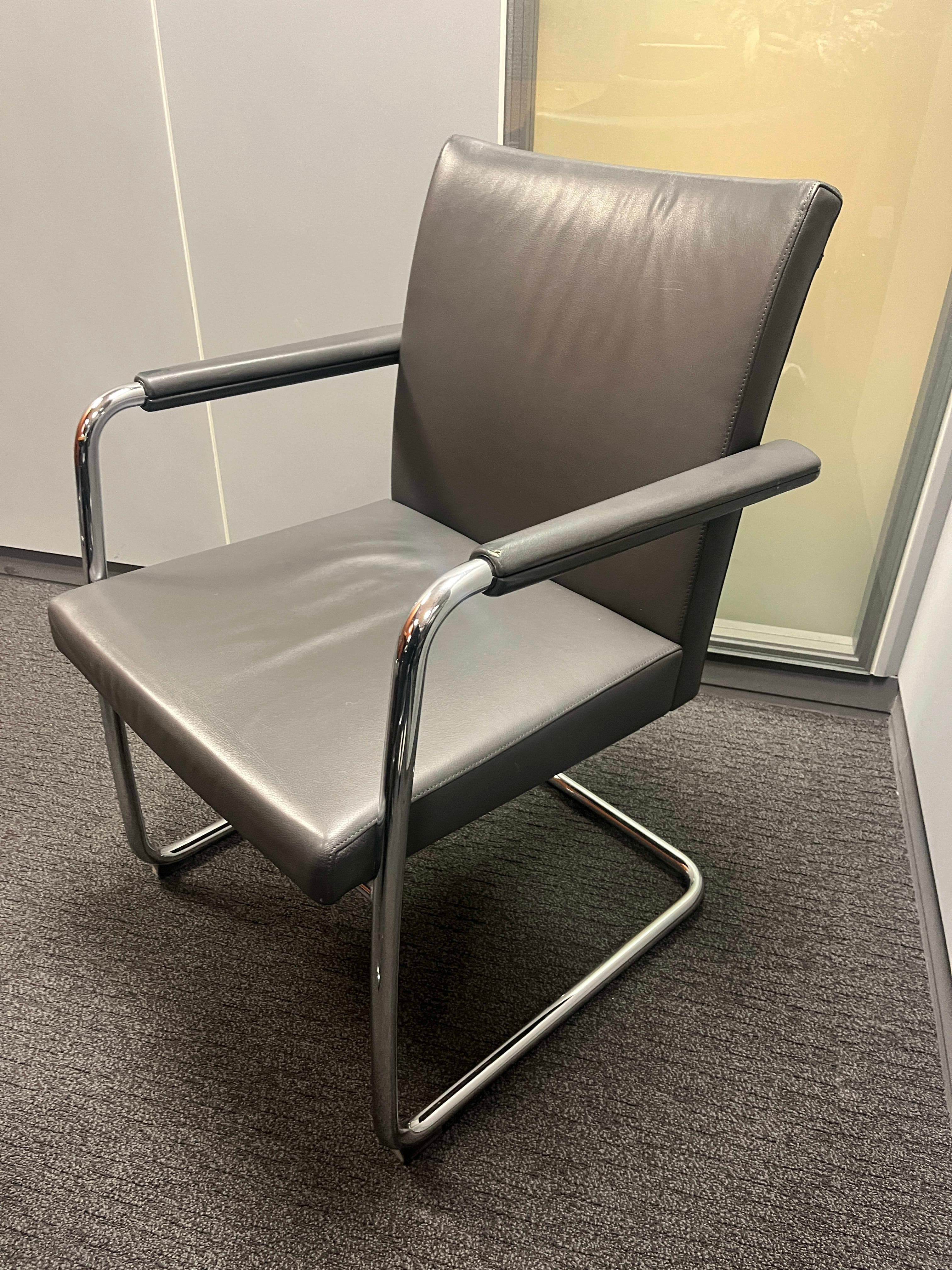 Brunner Grey leather chair with small scratches on the armrests-1