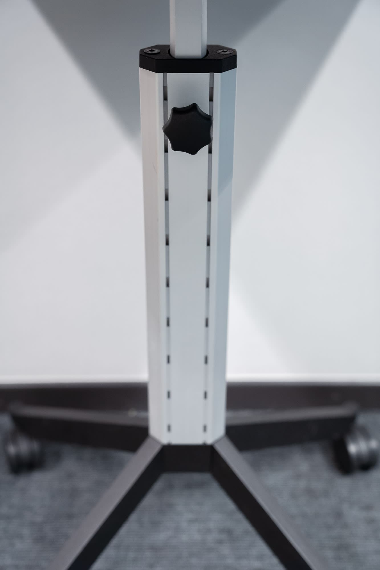 Black mobile 65cm table with height-adjustable on wheels