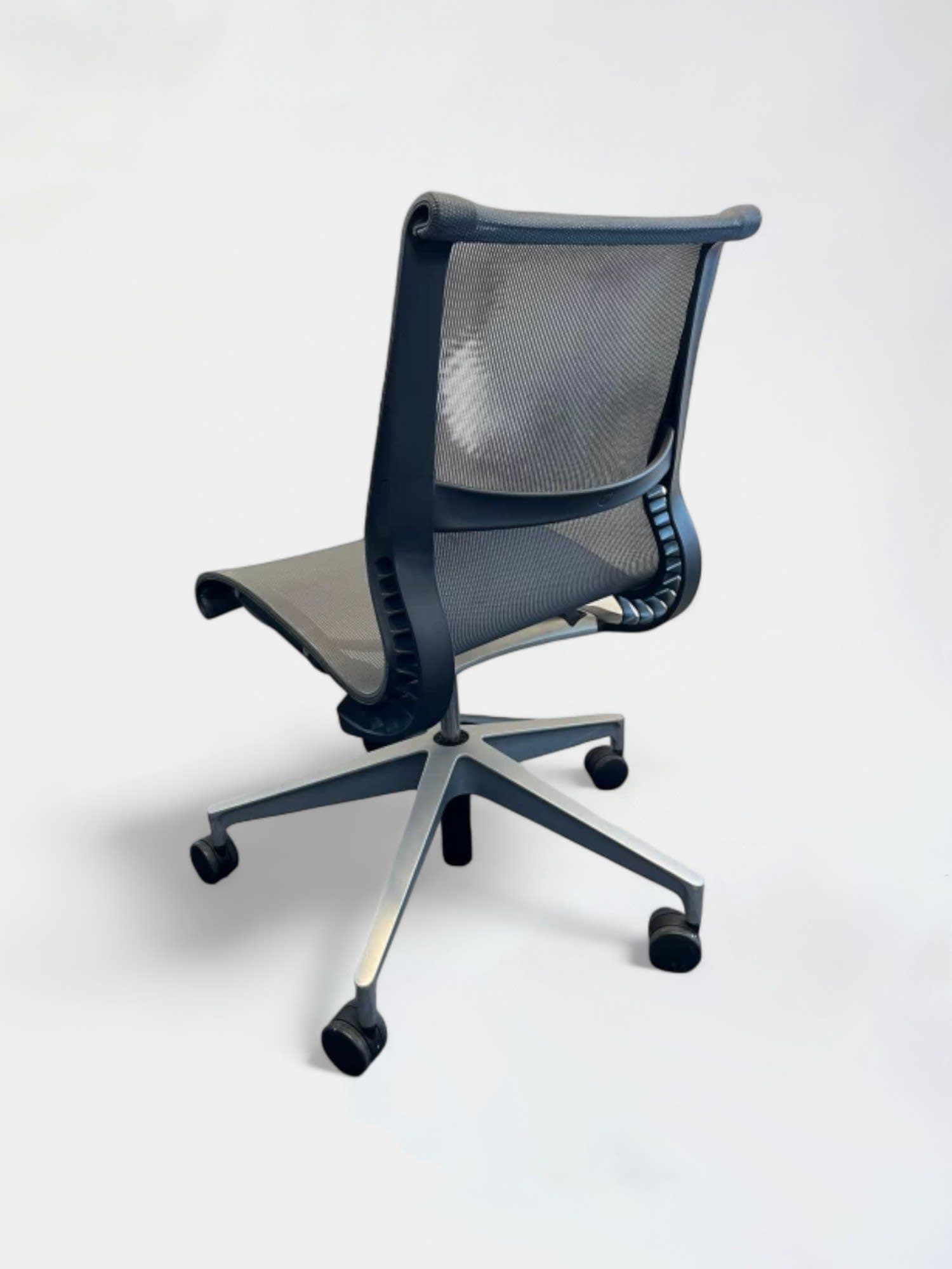 Herman Miller Setu mesh dark grey office chair without armrests on wheels-2