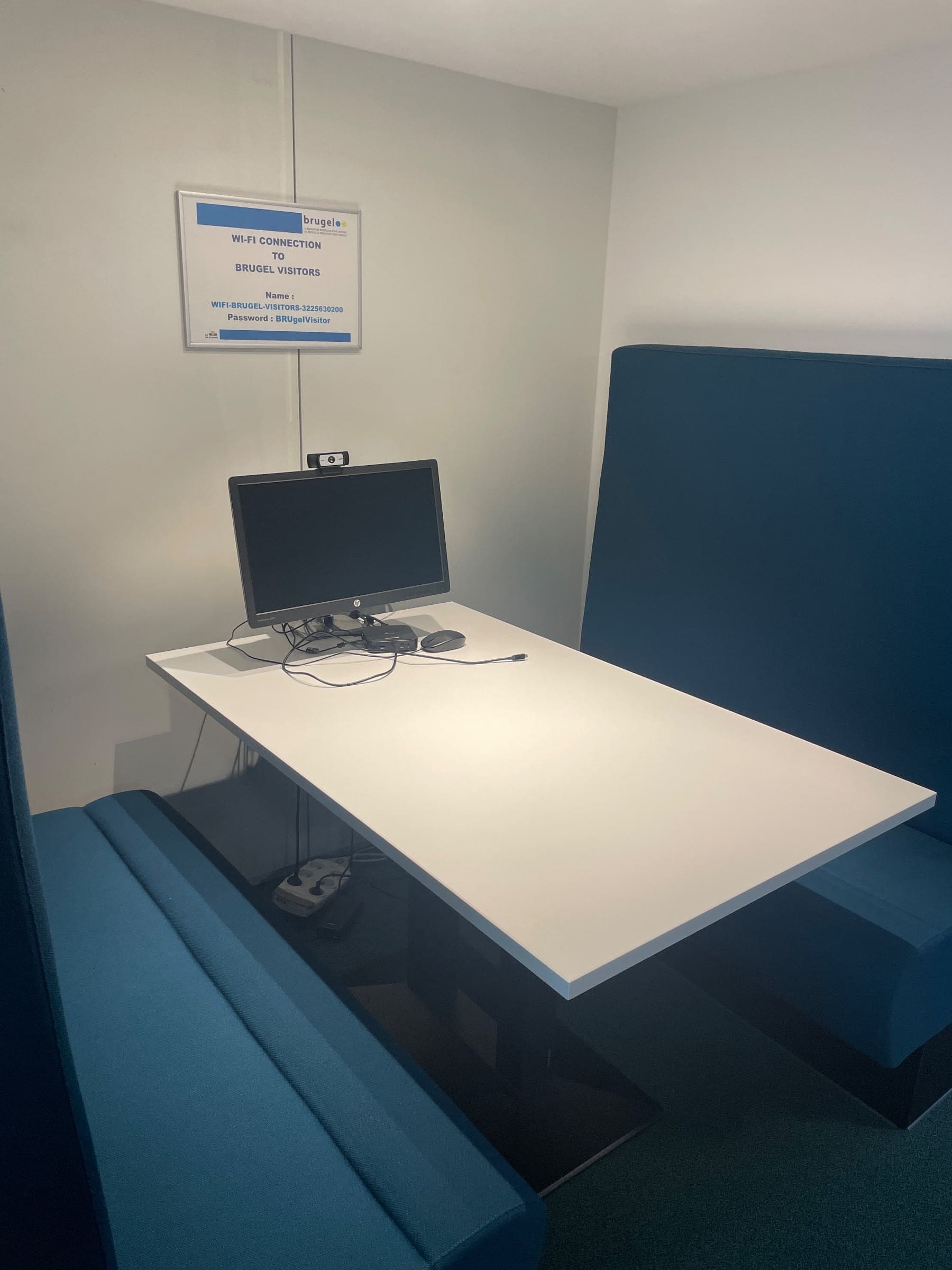 White 130cm laminate table with a black metal base for collaborative workspaces-1