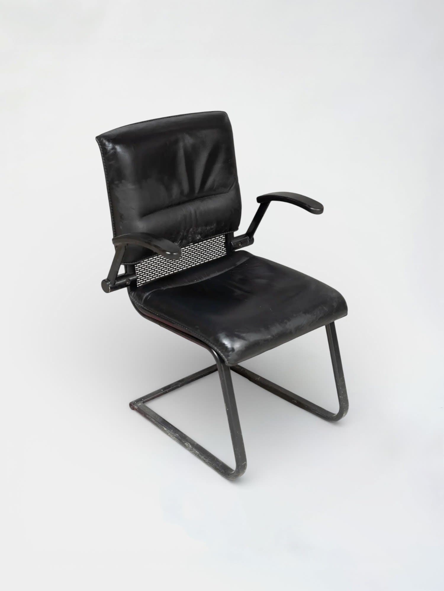 Black leather chair on black legs-0