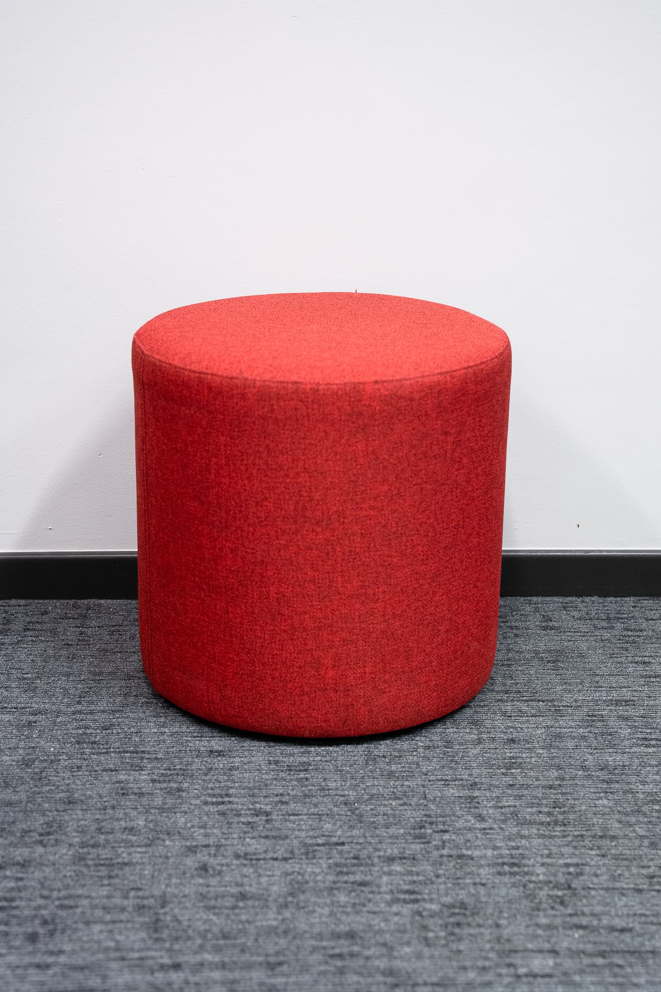 Round earth-red pouffe-0