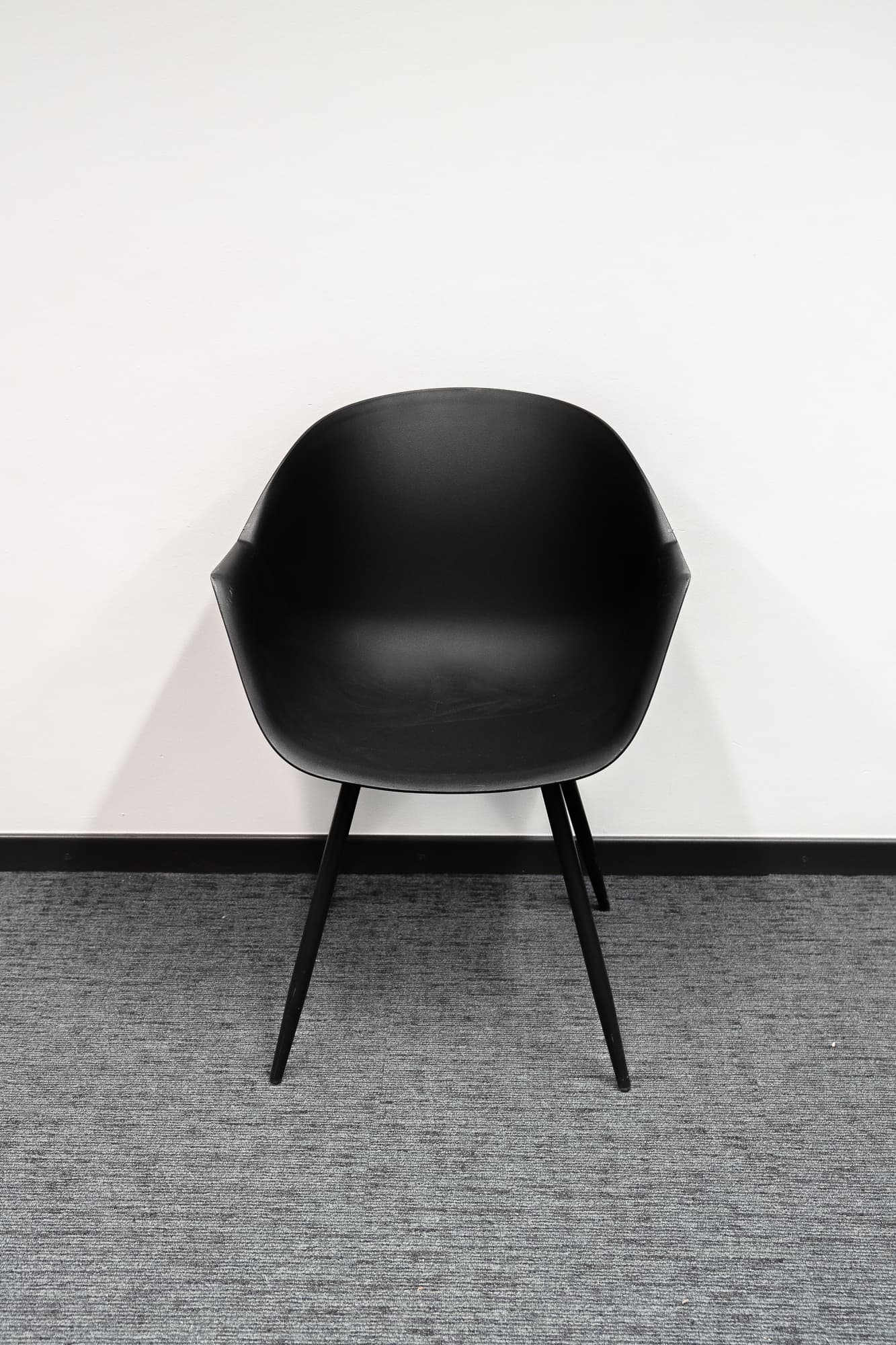 Black designer chair on black legs-0