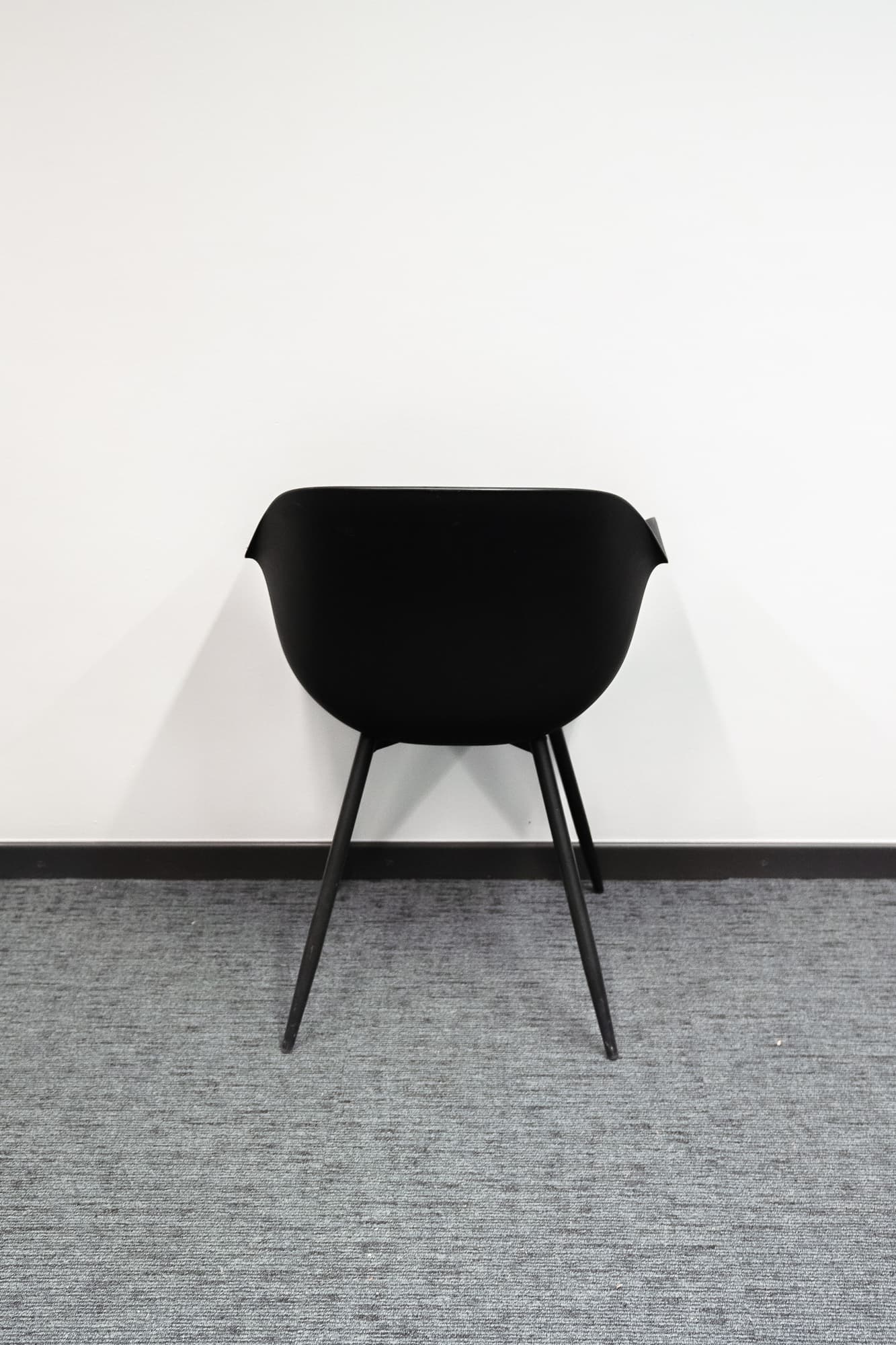 Black designer chair on black legs-2