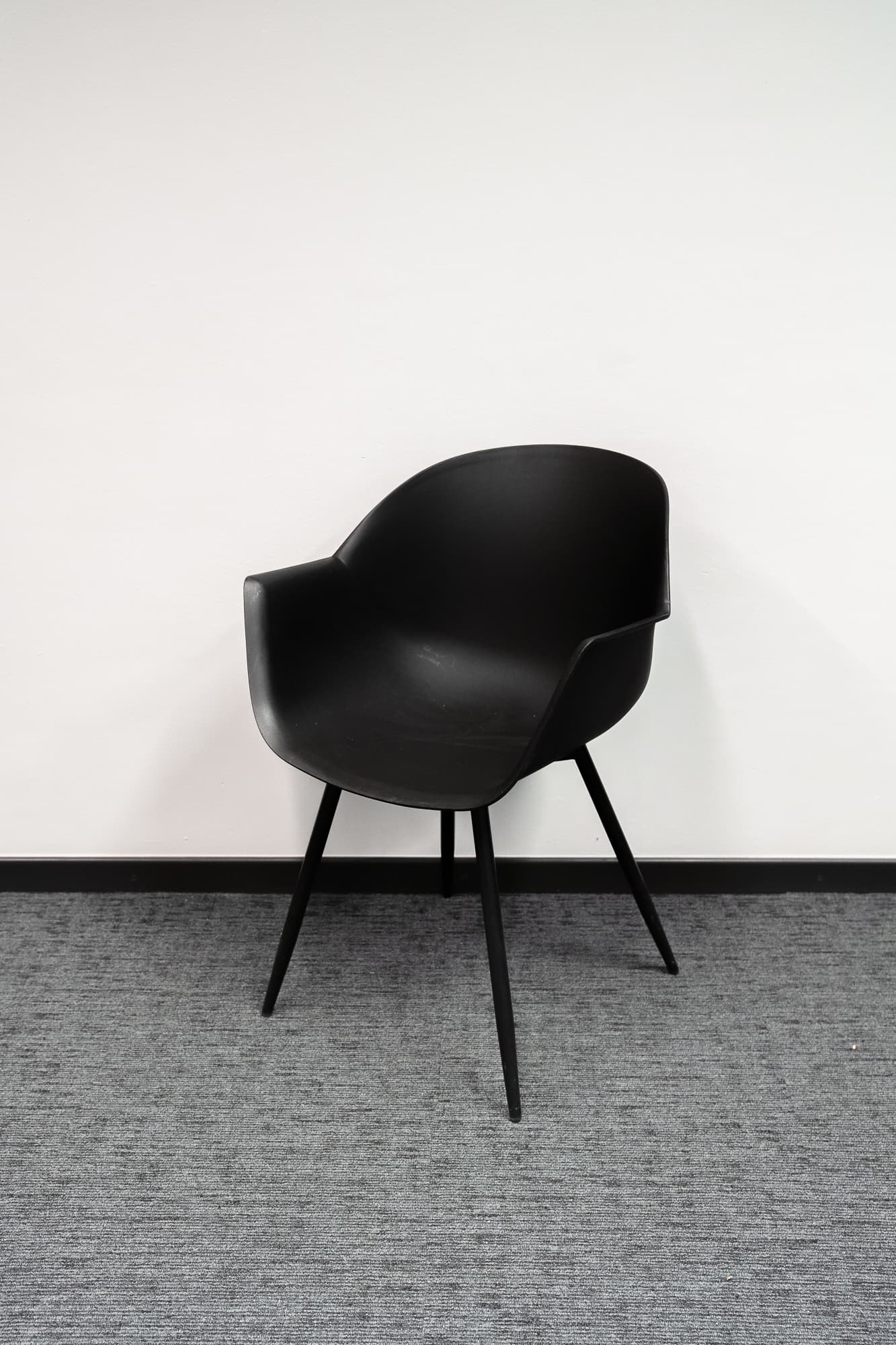 Black designer chair on black legs-1