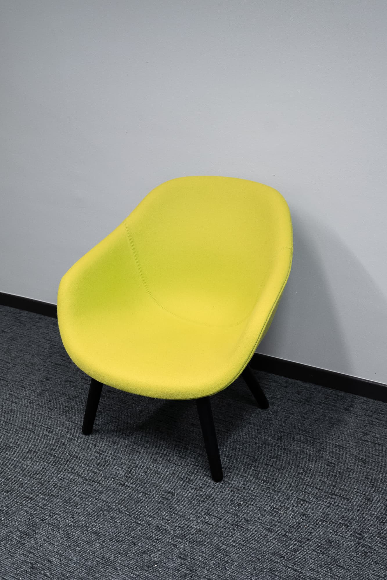 Yellow/green flash armchair on dark wooden legs-1