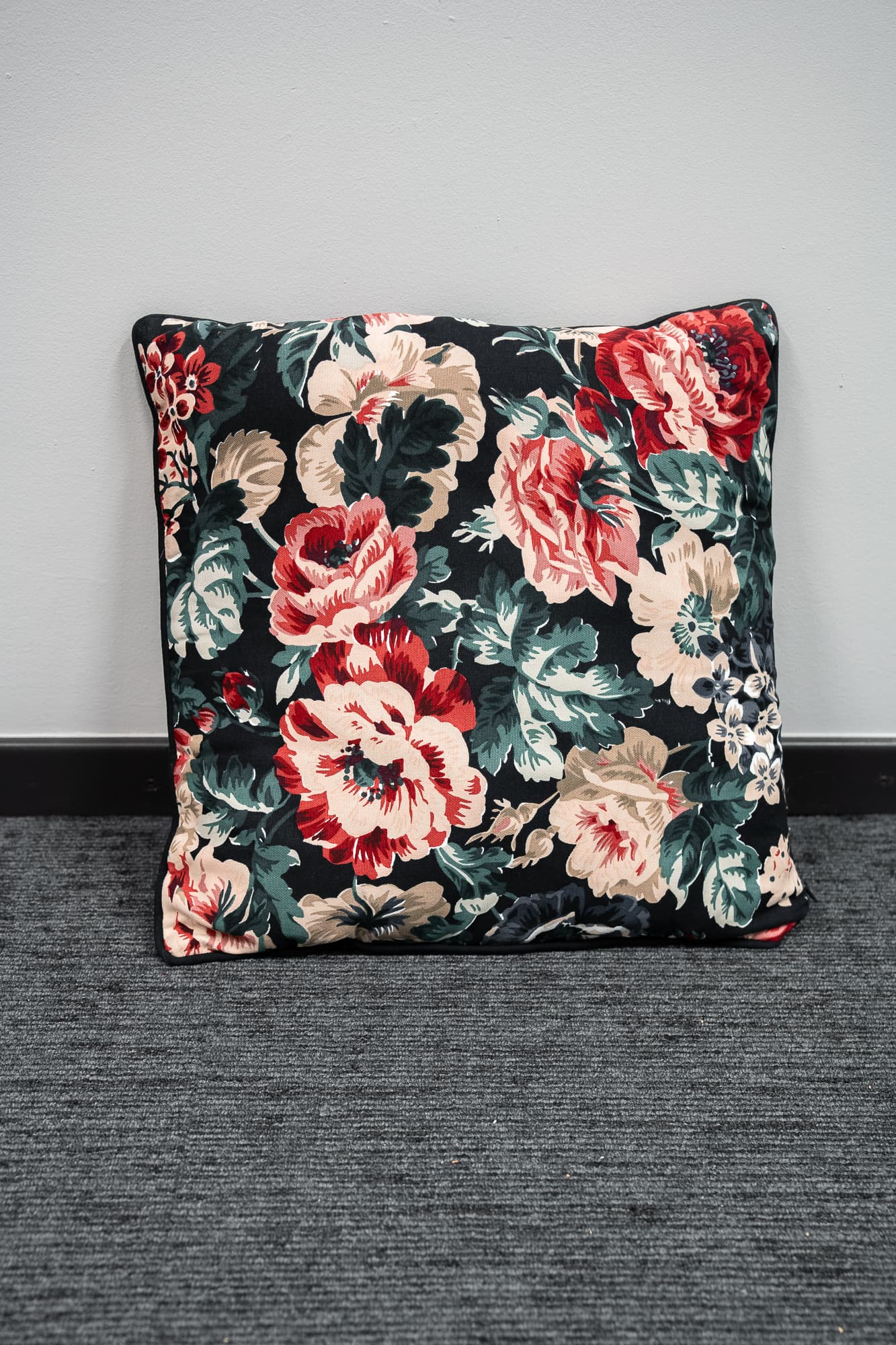 black cushion with floral motifs-0