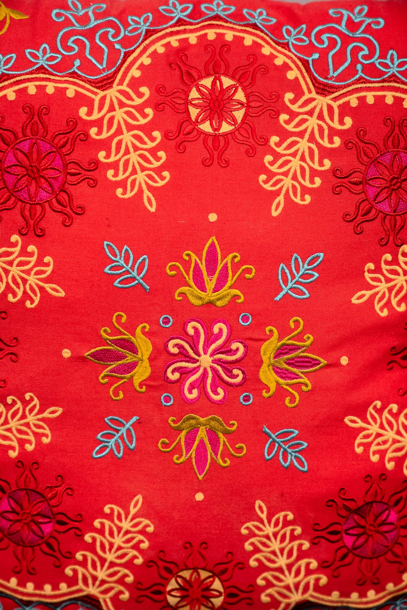 orange / red cushion with floral motifs-2