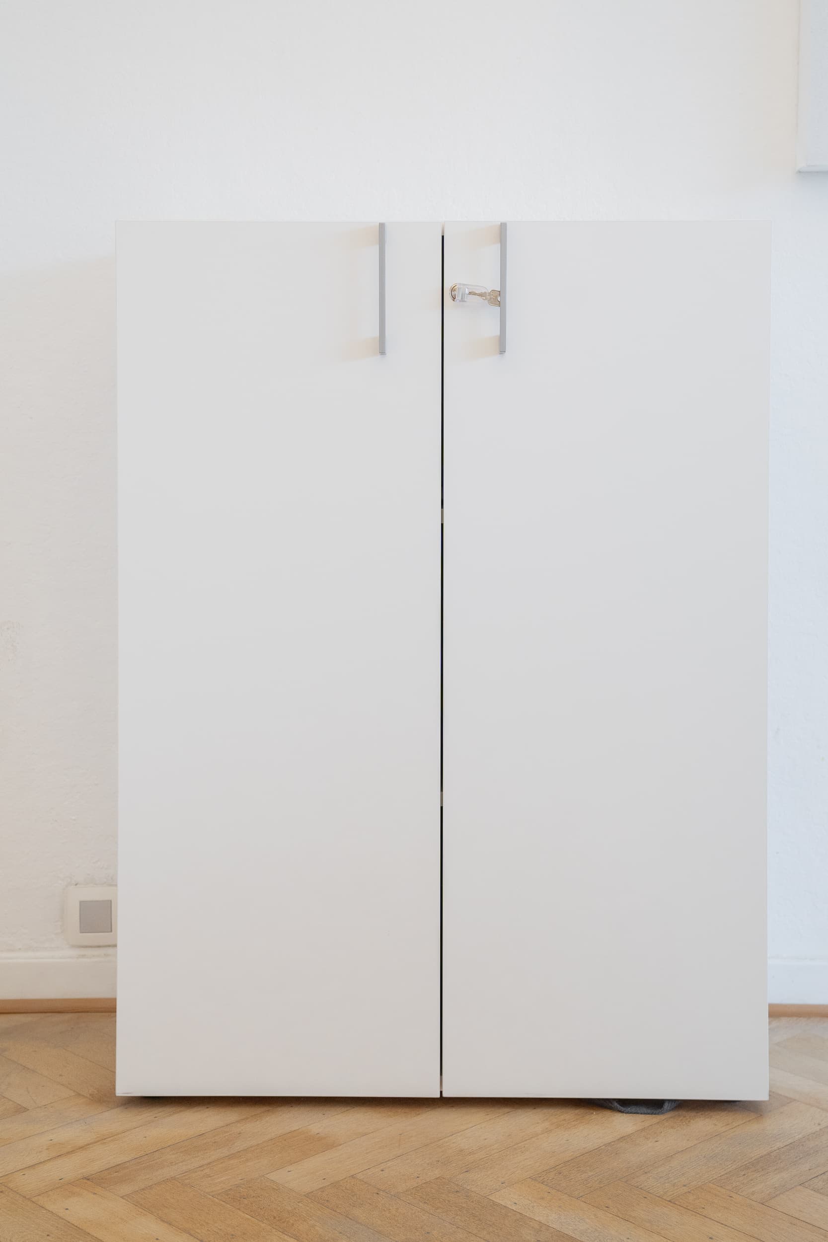 White lockable cupboards with metal handles-0