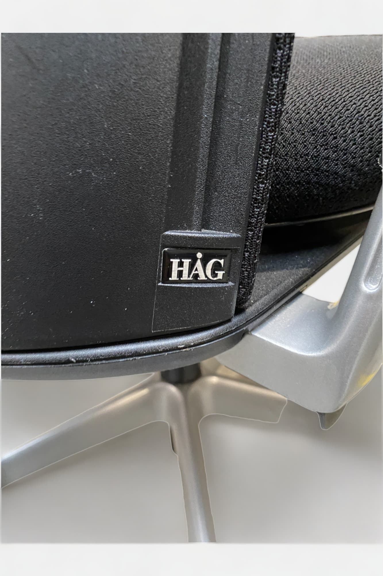 HAG Adjustable black office chairs on wheels-7