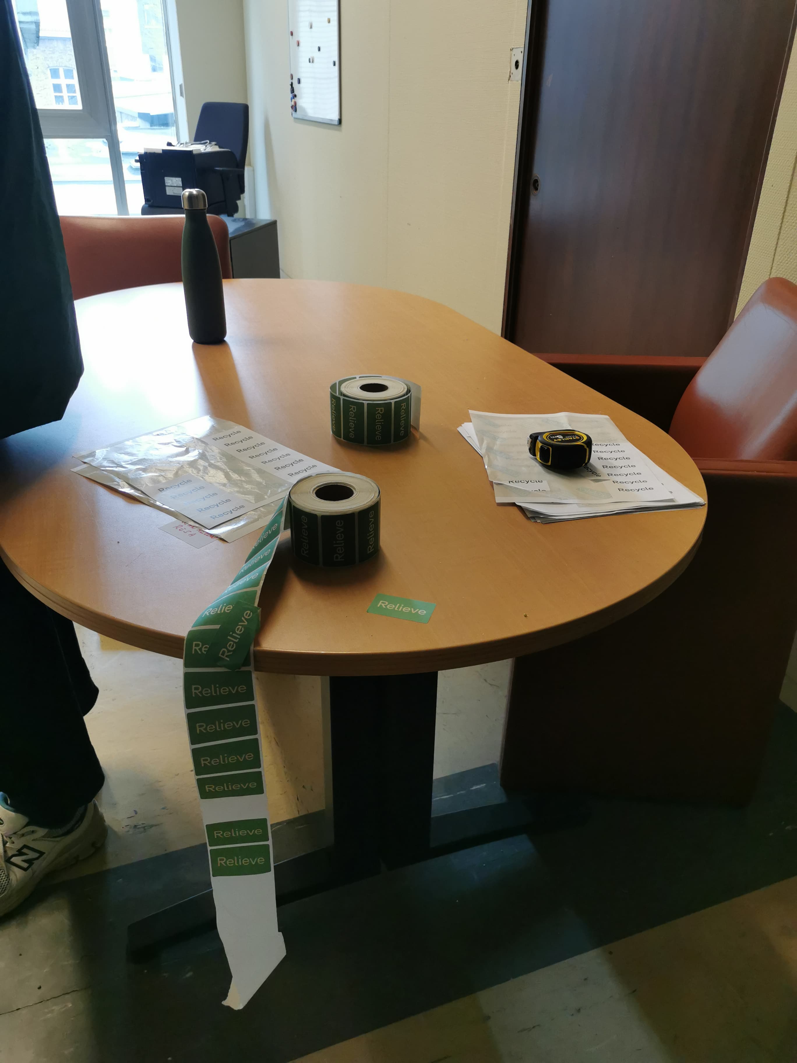 Oval wood meeting table on T black legs-0