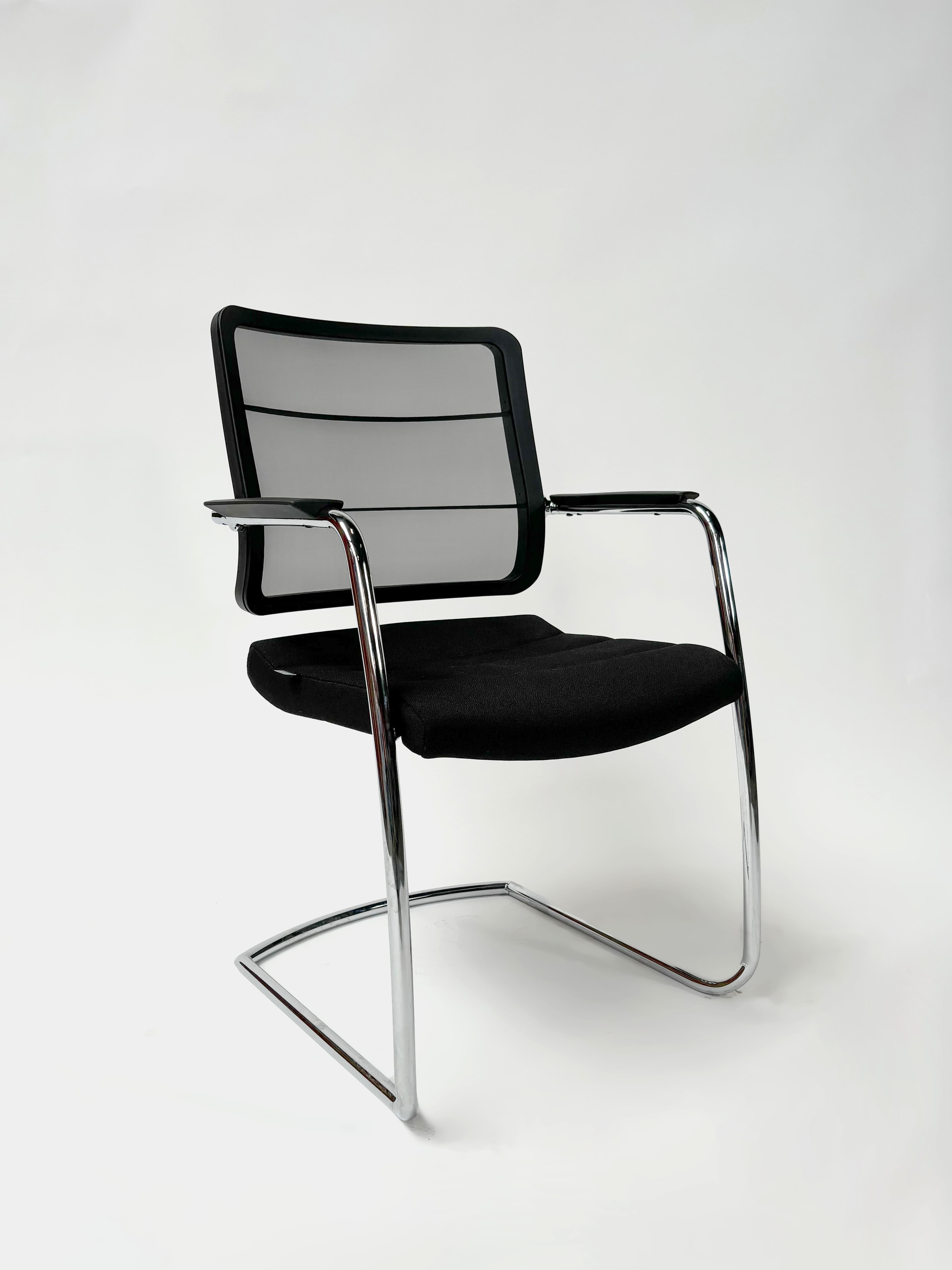 INTERSTUHL Black cushioned chair with mesh back-0
