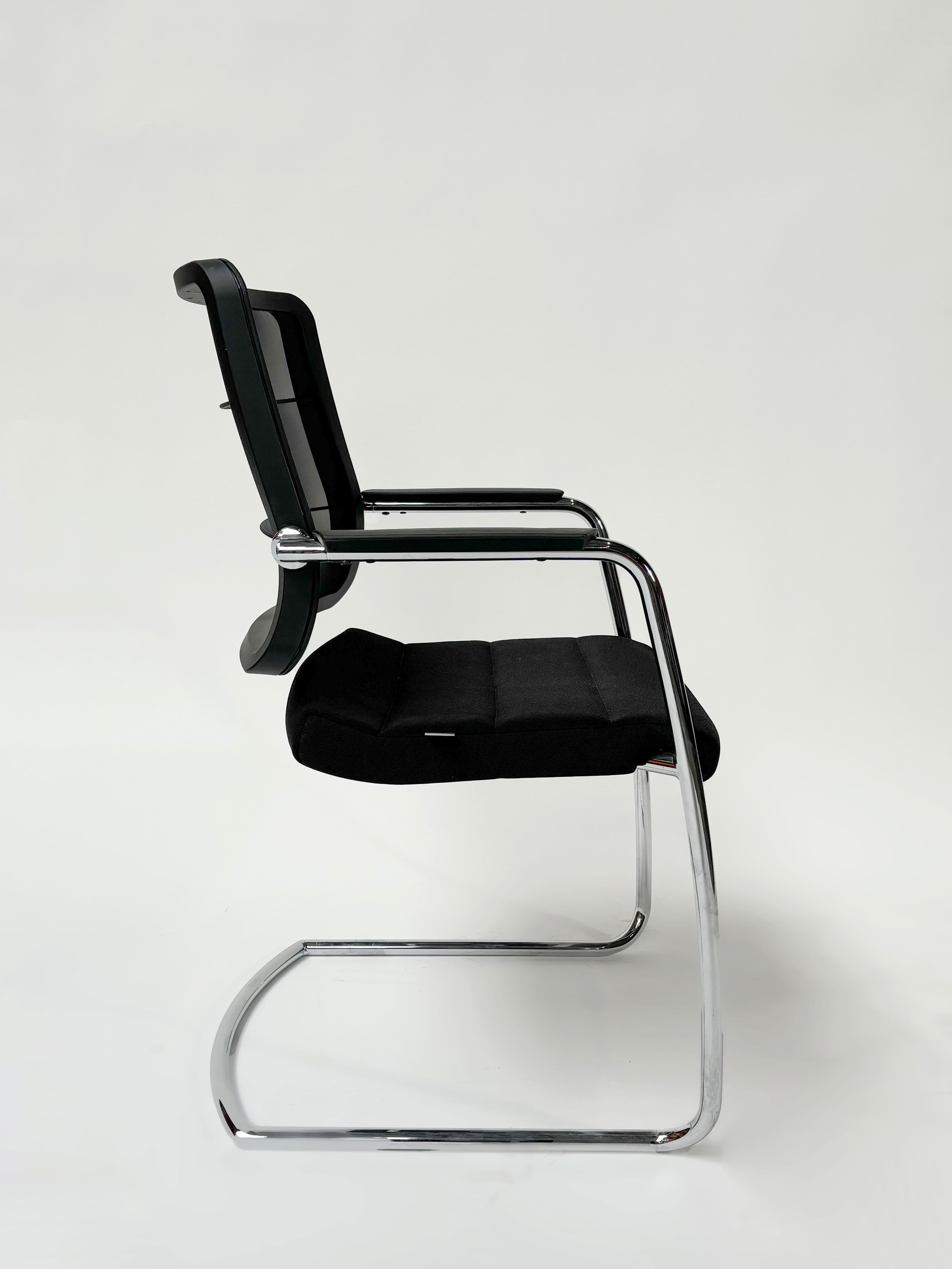 INTERSTUHL Black cushioned chair with mesh back-3