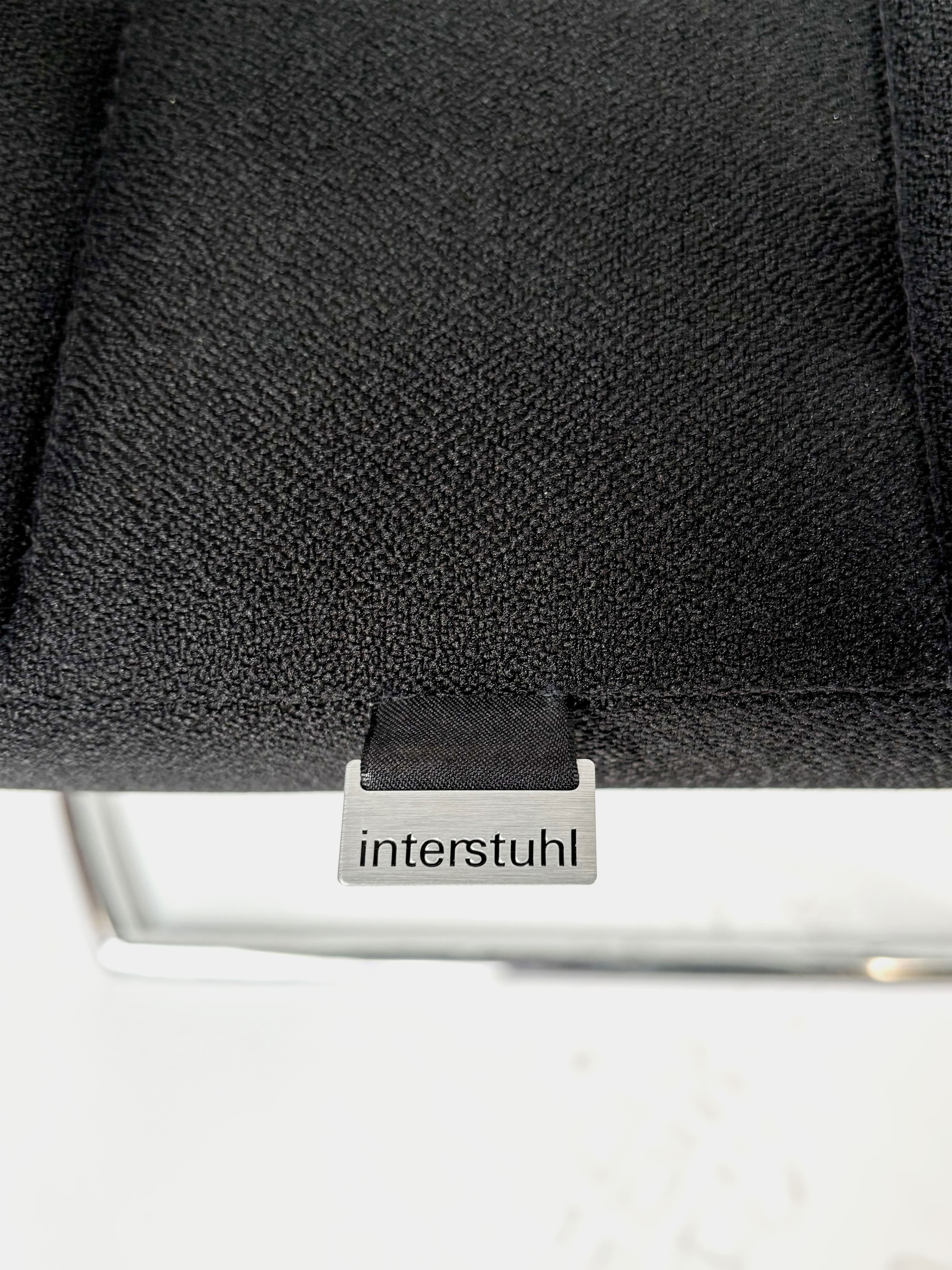 INTERSTUHL Black cushioned chair with mesh back-4