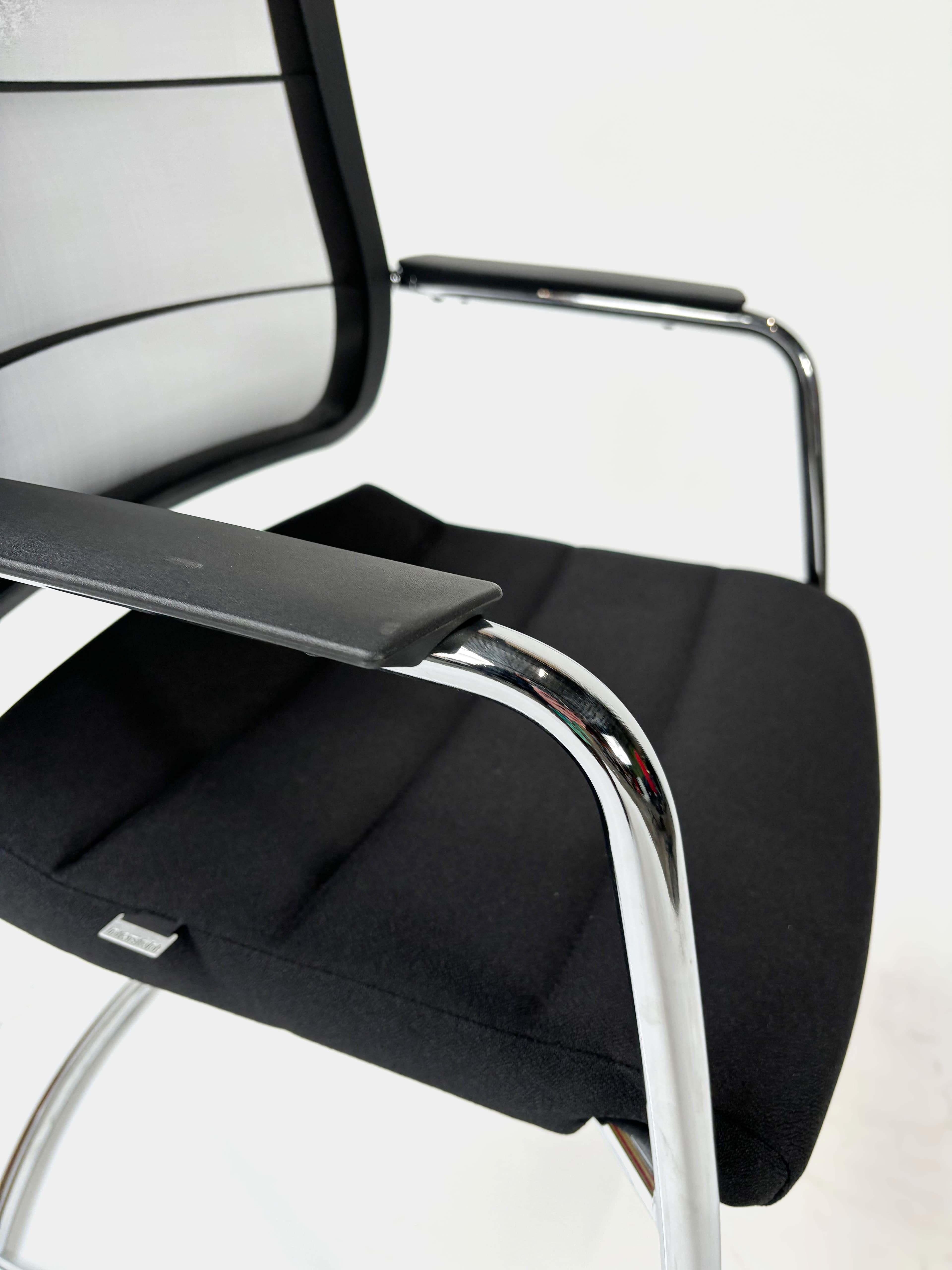 INTERSTUHL Black cushioned chair with mesh back-5