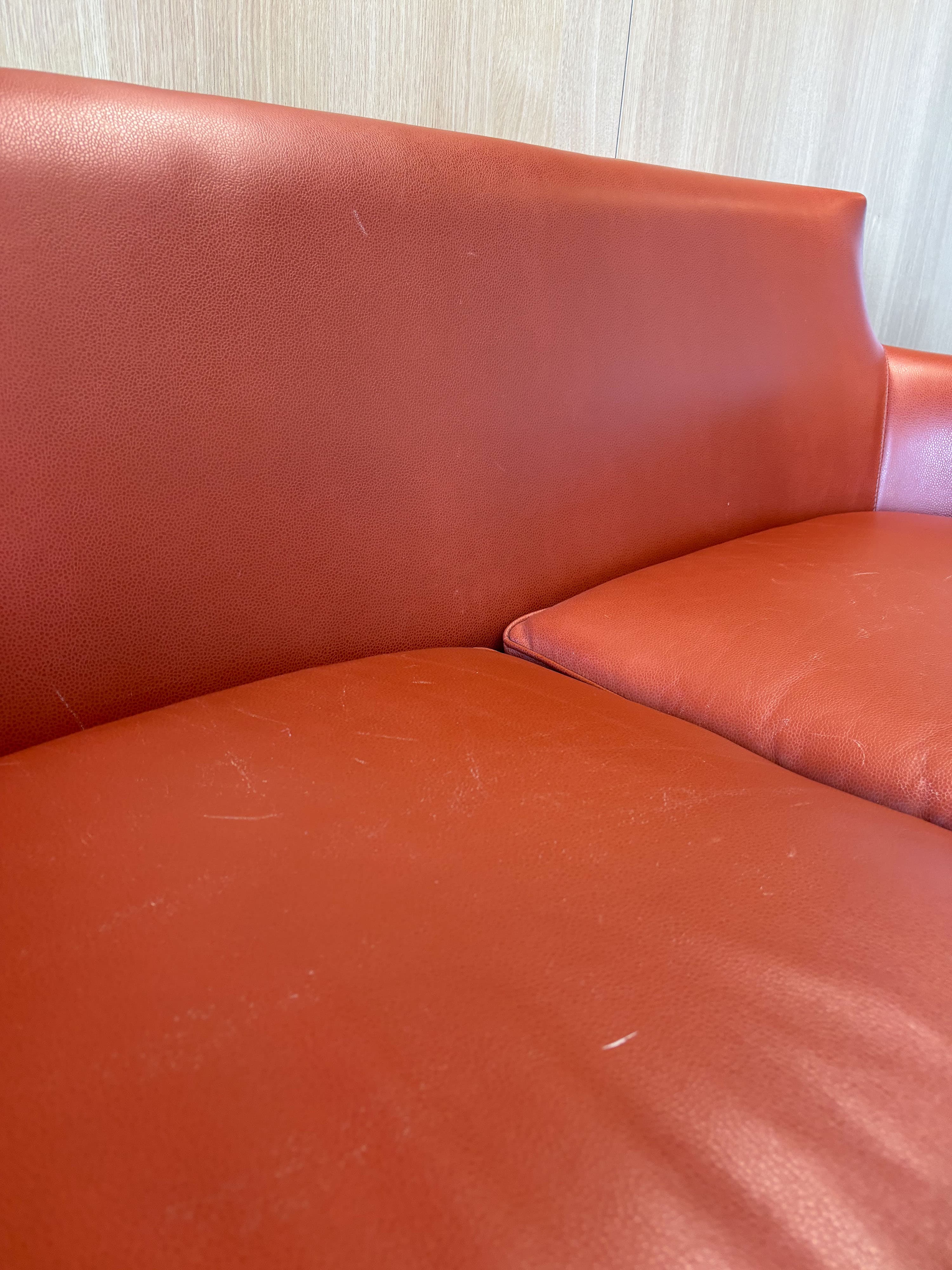 Orange Leather Sofa with Streamlined Modern Design-1