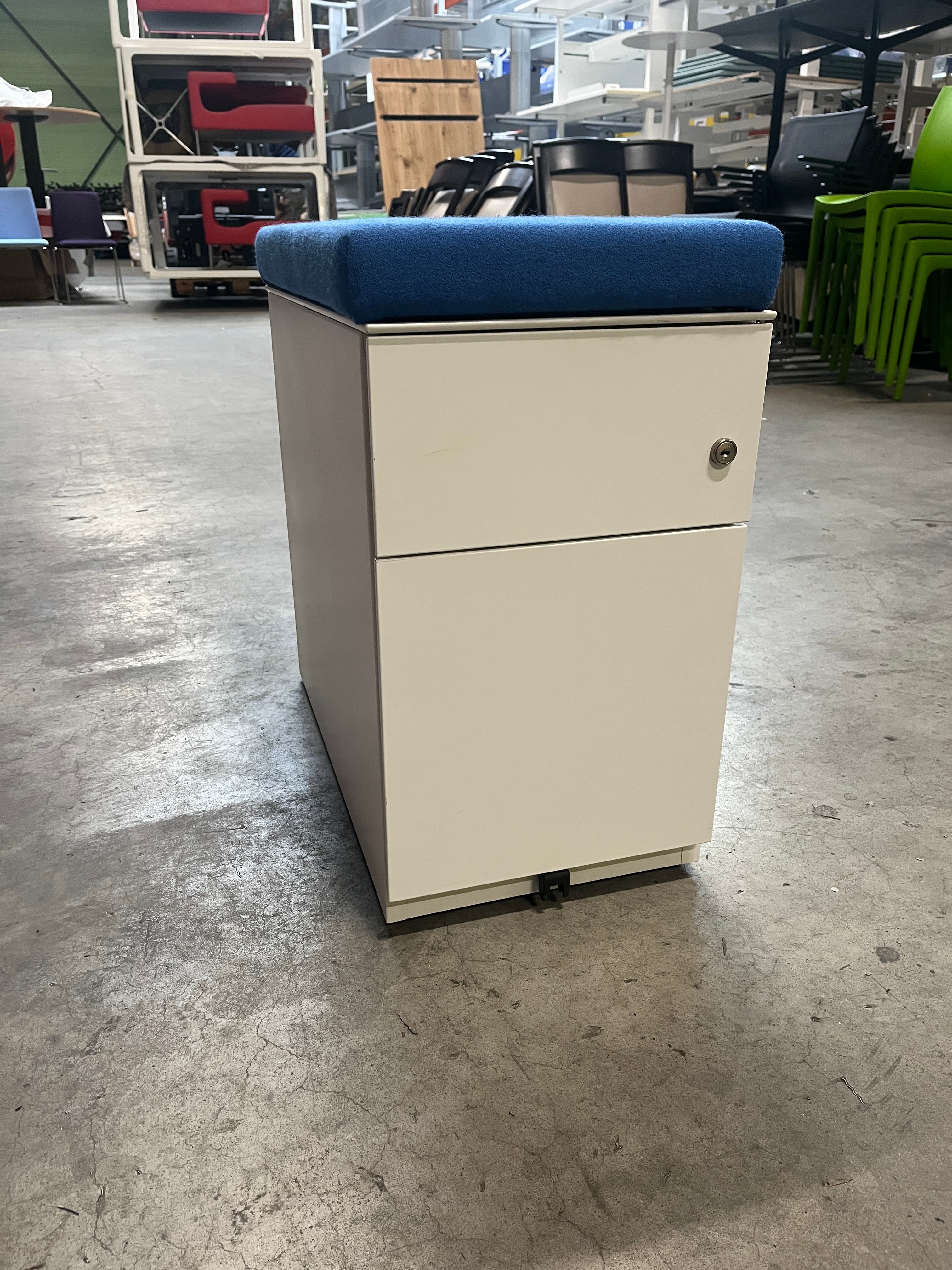 White drawer unit with fabric blue cushion top-1