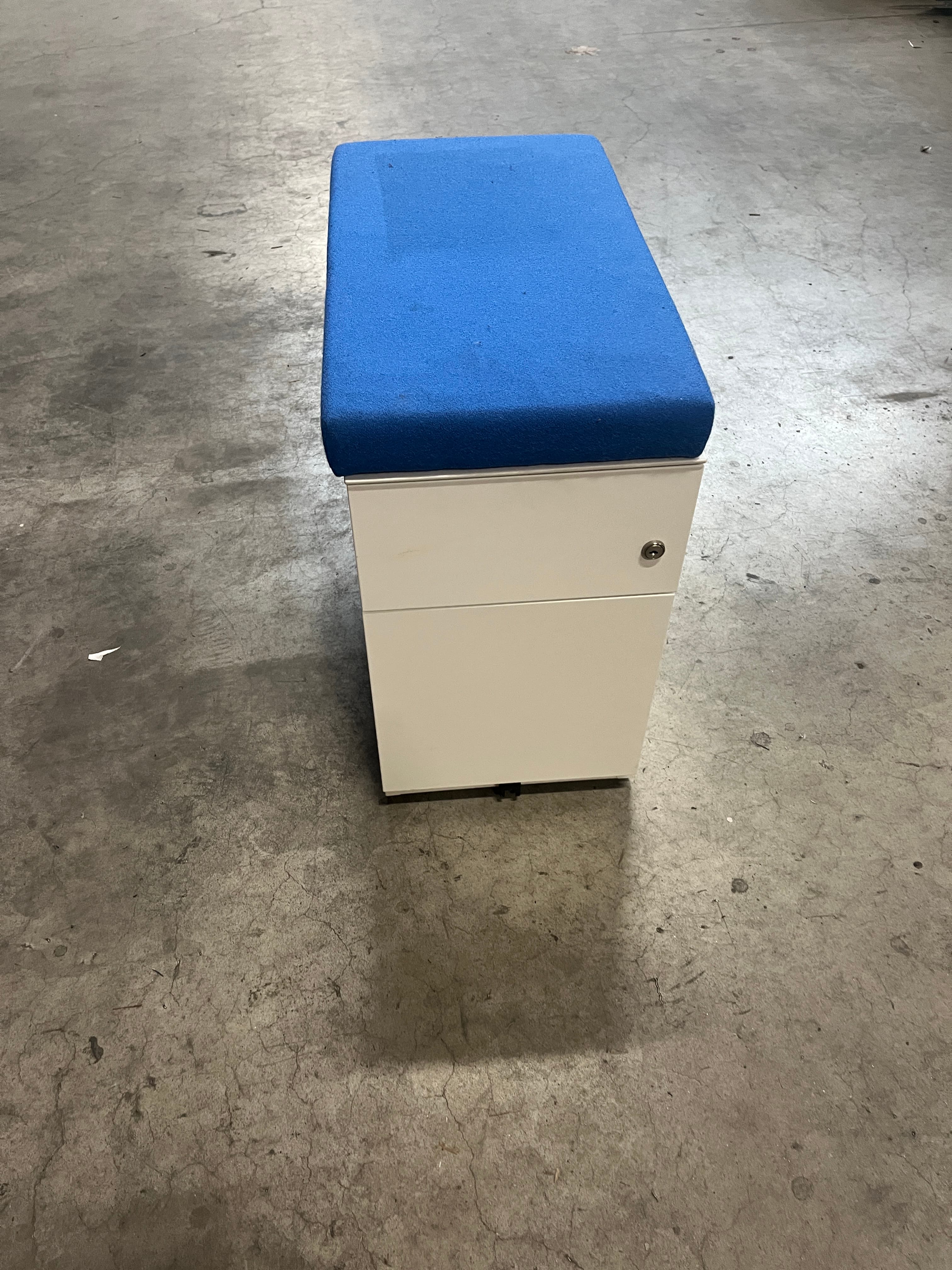 White drawer unit with fabric blue cushion top-3