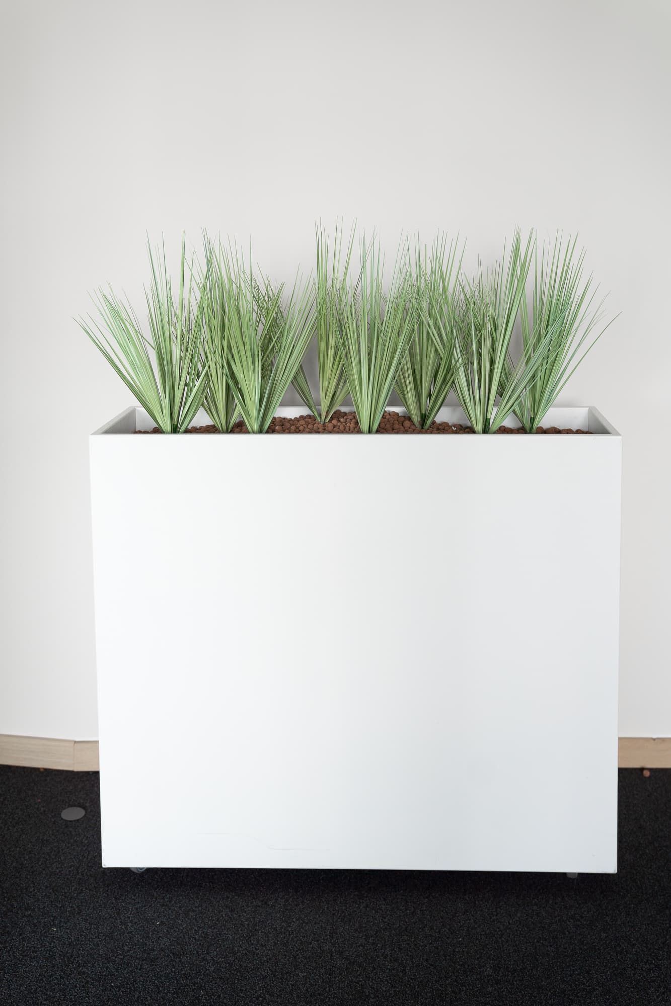 White planter with fake plants on wheels-3