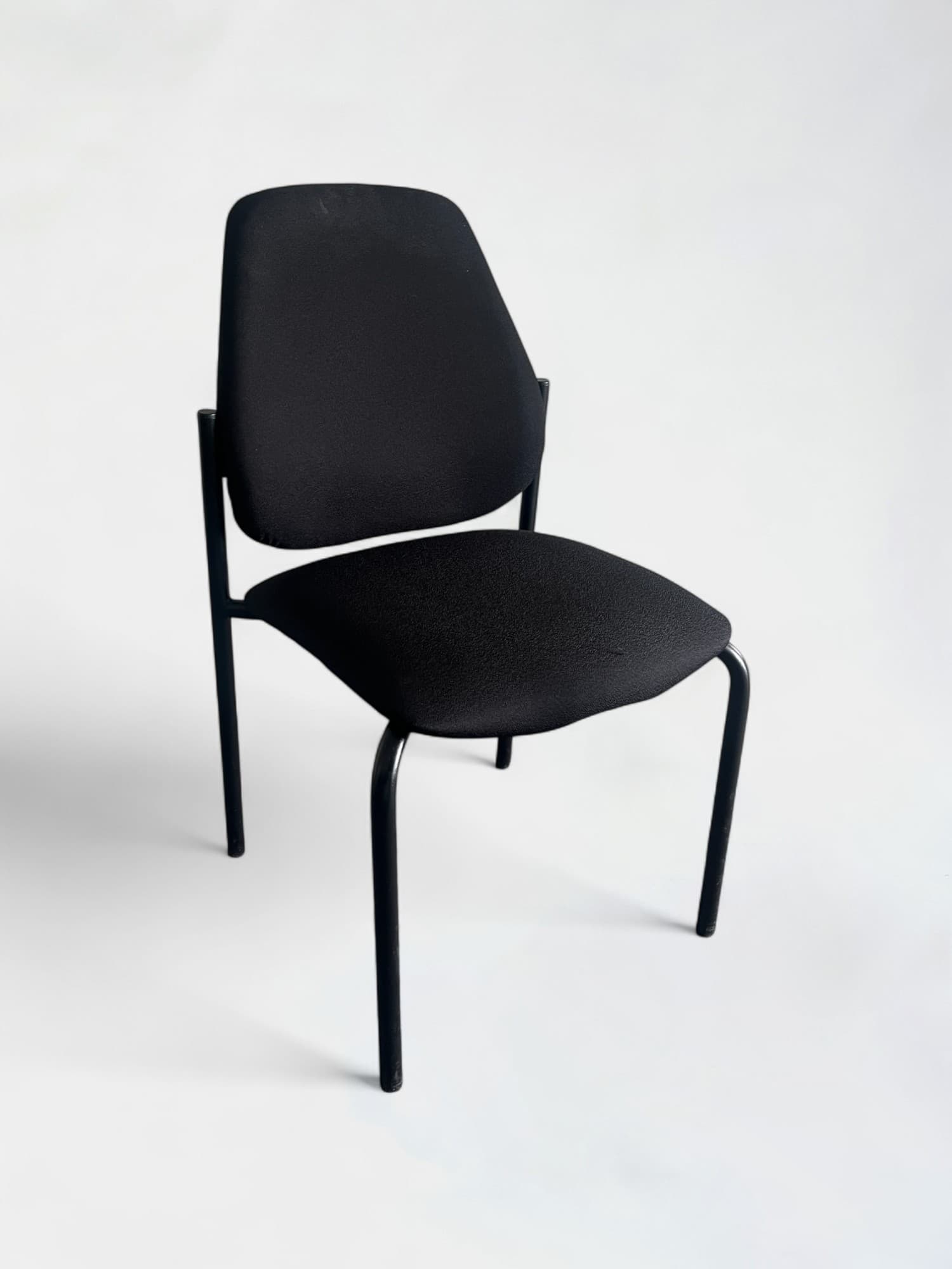 Black fabric meeting chair without armrests