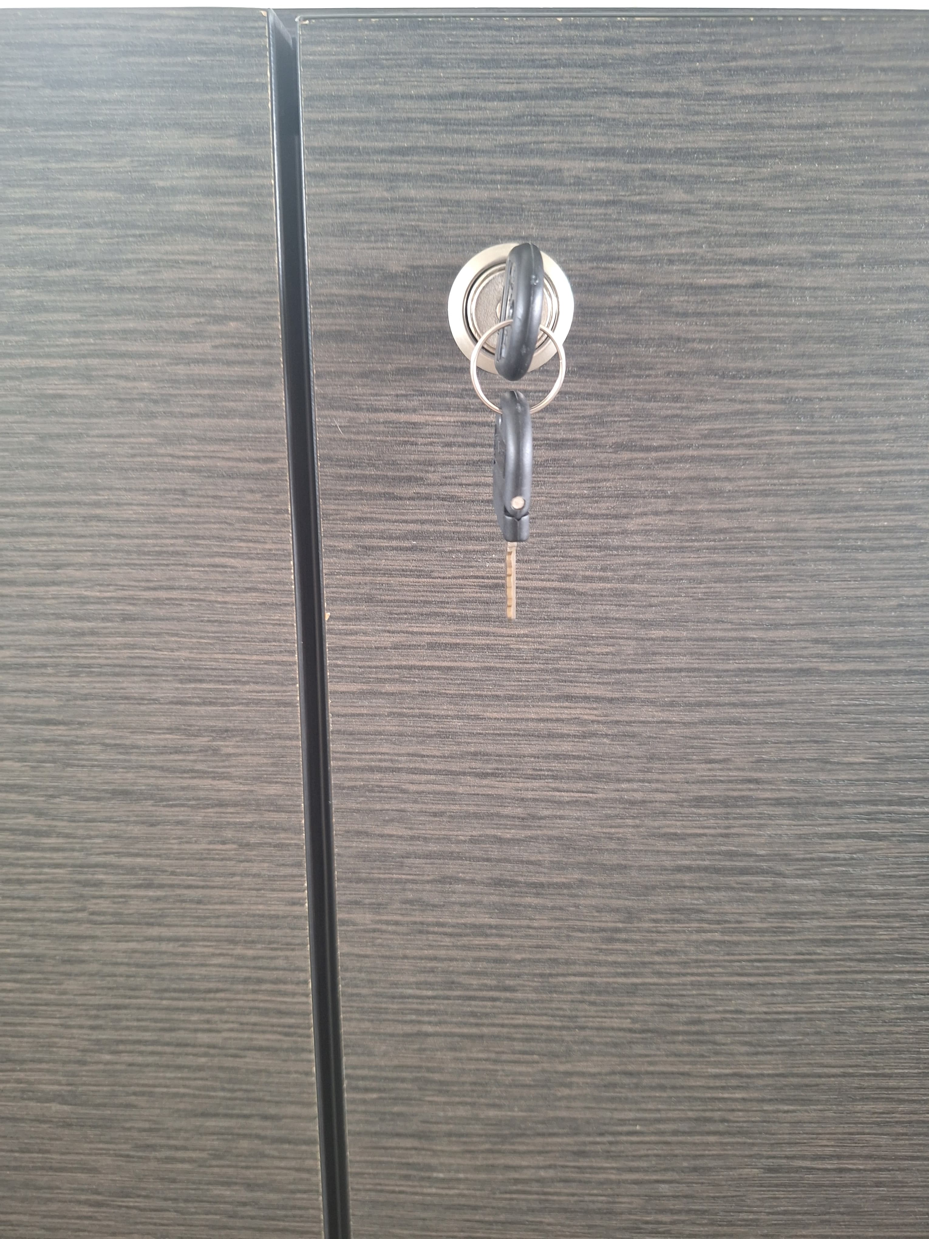 Dark Grey wood storage cabinet with locking mechanism. Signs of use at the bottom-2