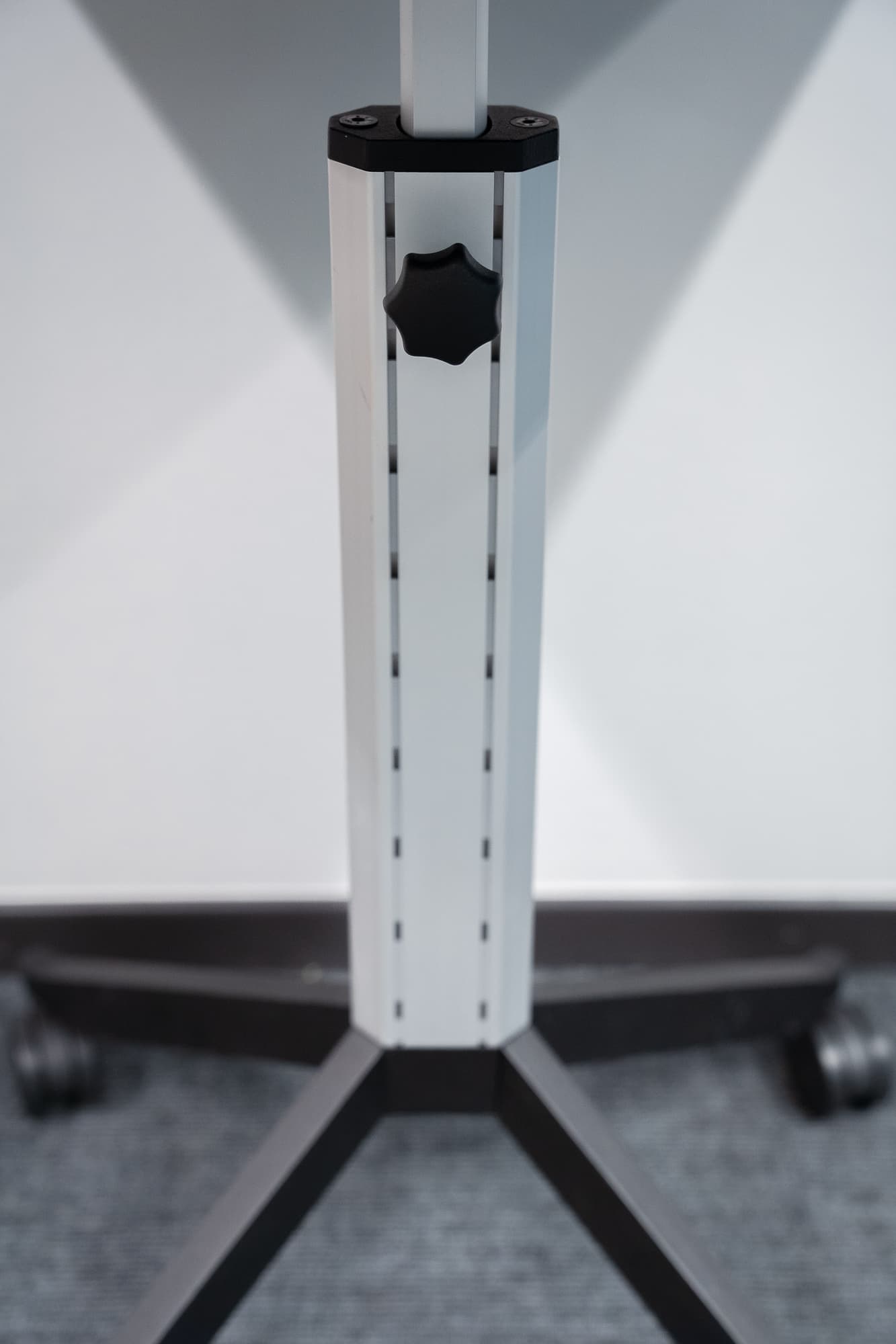 Black mobile table with height-adjustable on wheels-1