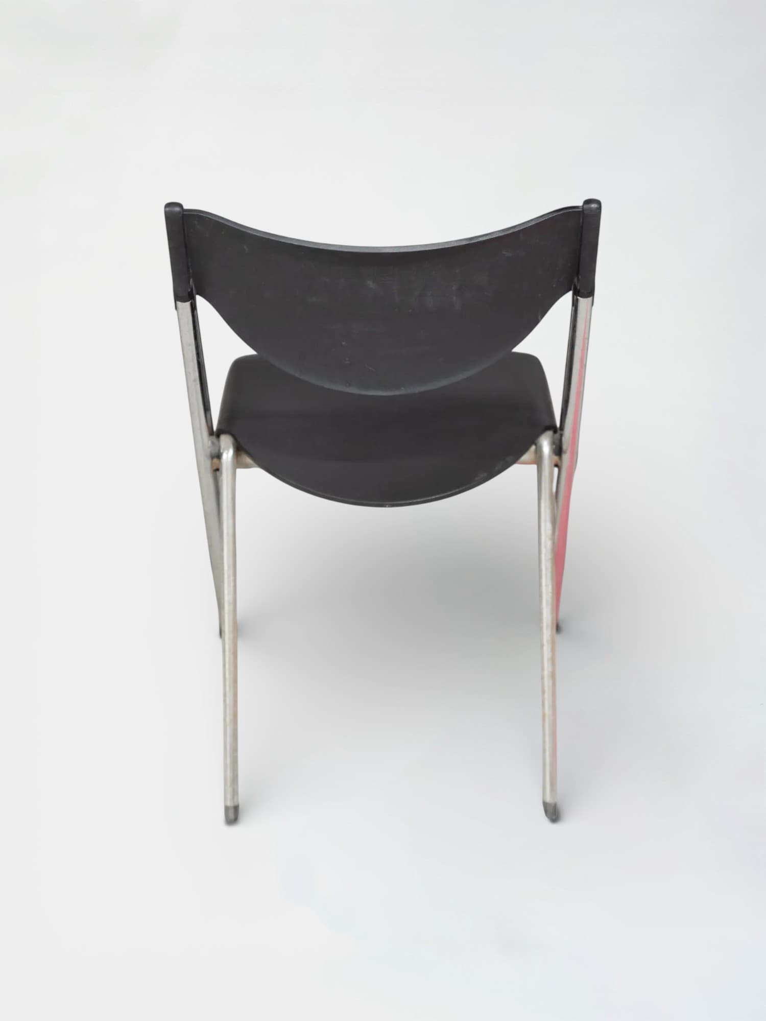 Black plastic folding chair with chrome legs and ergonomic design-1