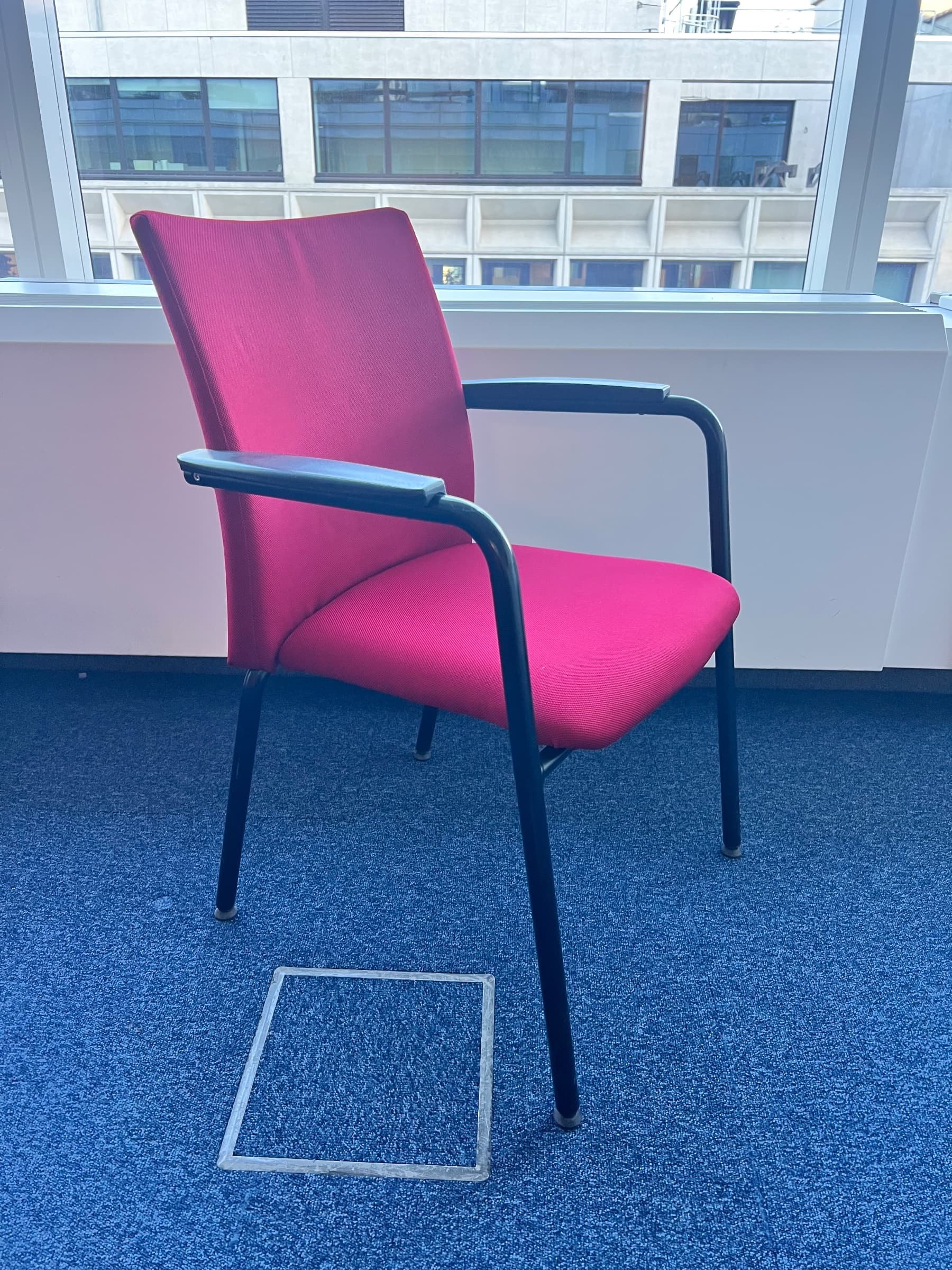 Red fabric office chair with armrests