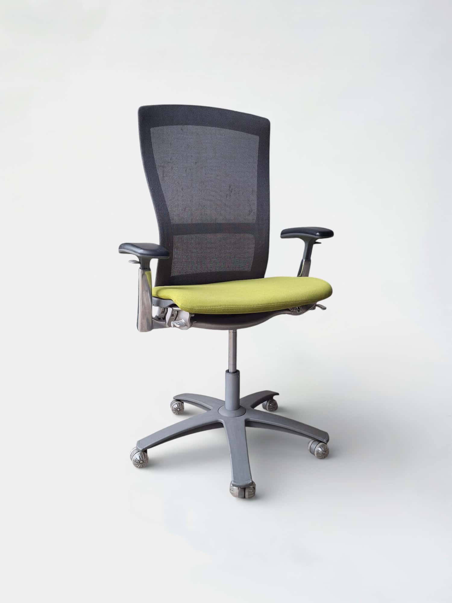 Knoll Adjustable office chair with green seat and grey mesh back on wheels product image