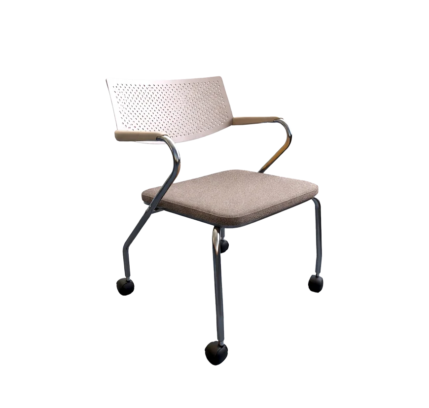 A reused meeting chair with a perforated back